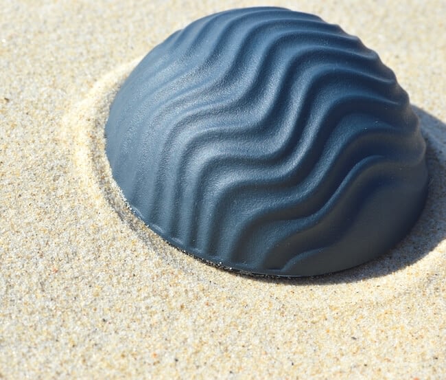 Medium DomeSeashell with contours reminscent of windswept sand, or lines of ocean swell